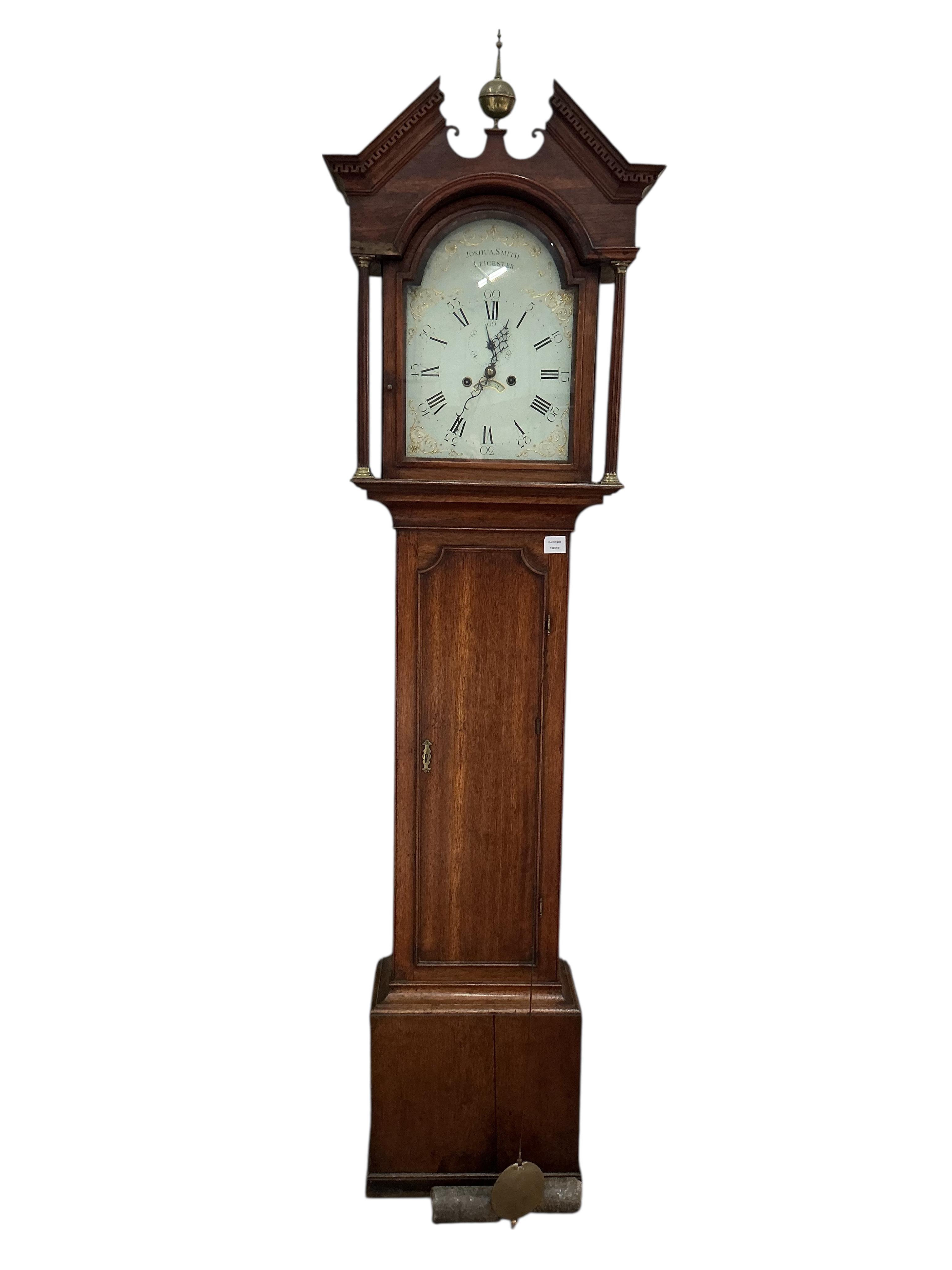 A George III oak eight day longcase clock, the arched painted enamel dial with Roman numerals and outer Arabic minutes, subsidiary seconds dial and calendar aperture, marked Joshua Smith, Leicester, height 216cm